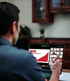 BNI Member on a laptop using BNI Online Meeting Platform on Zoom